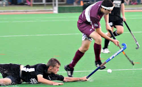 An All Blacks’ defender makes a desperate diving tackle on Heat striker Mitchell Kuether in their Premier League match on Saturday in Bundaberg. An All Blacks’ defender makes a desperate diving tackle on Heat striker Mitchell Kuether in their Premier League match on Saturday in Bundaberg.